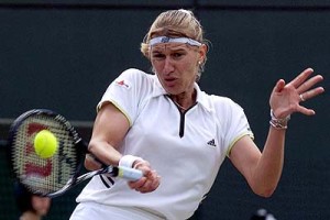 FILE--Steffi Graf returns to Croatia's Mirjana Lucic during their Women's Singles, semifinal match on Wimbledon's Number One Court, July 3, 1999. Graf, one of just five players to complete the tennis Grand Slam in one year and a dominating force for more than a decade, retired from the sport Friday, August 13, 1999, saying her ``motivation wasn't what it was in the past.'' (AP Photo/Adam Butler)